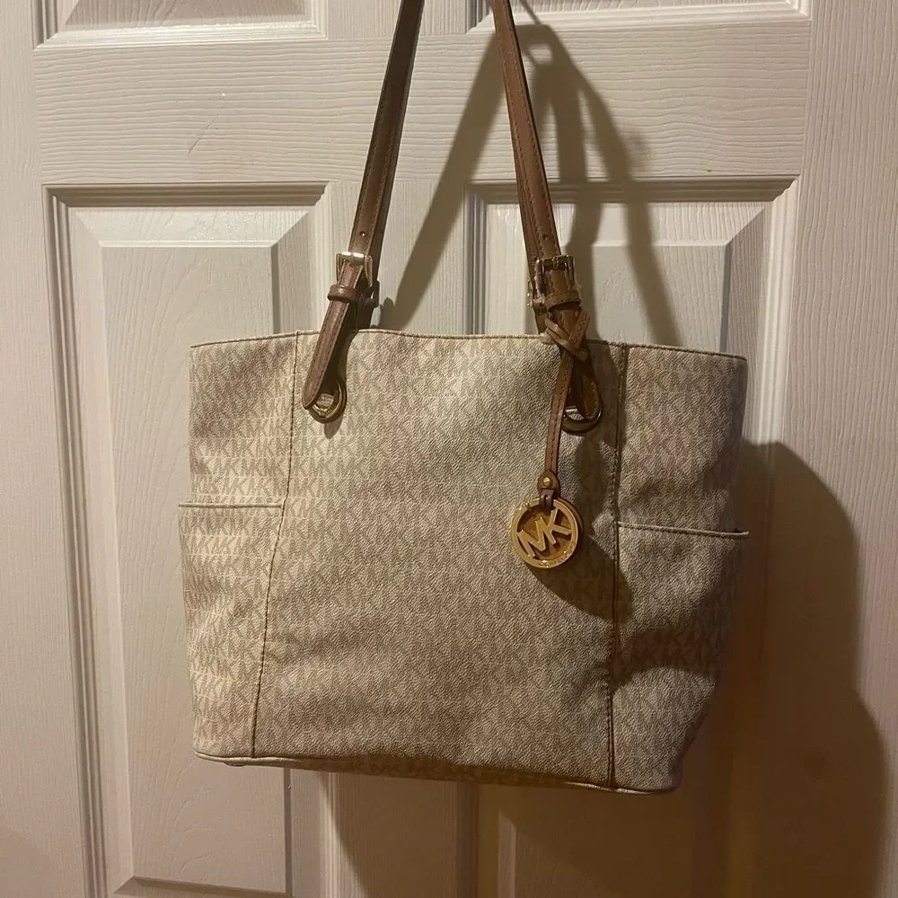 Michael Kors Beige signature Coated Canvas tote , tan leather straps .